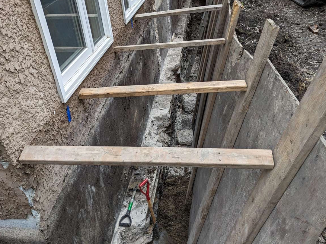 A foundation repair setup for an Oak Bluff property.