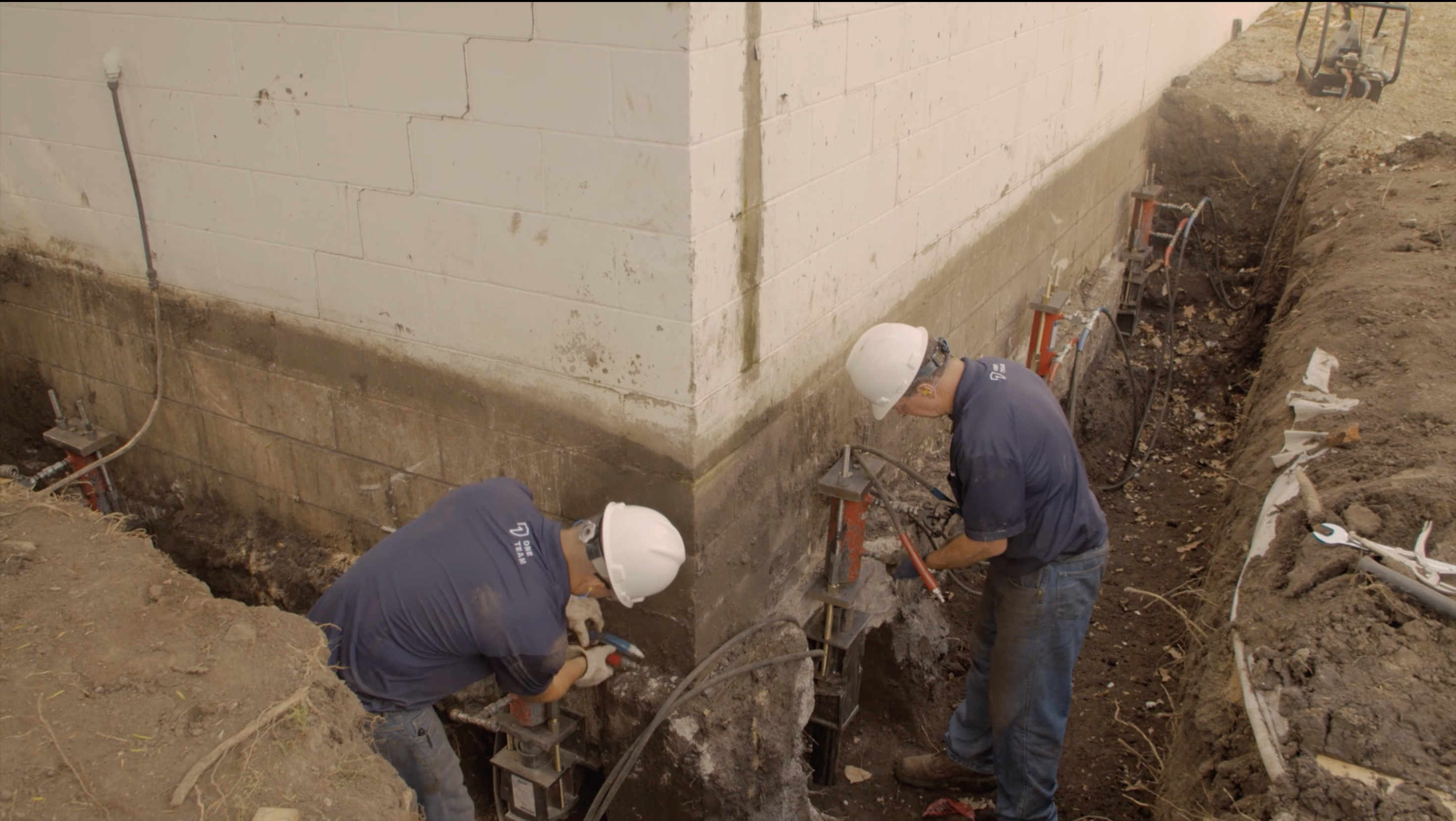 Sump installation team ensuring reliable basement waterproof system